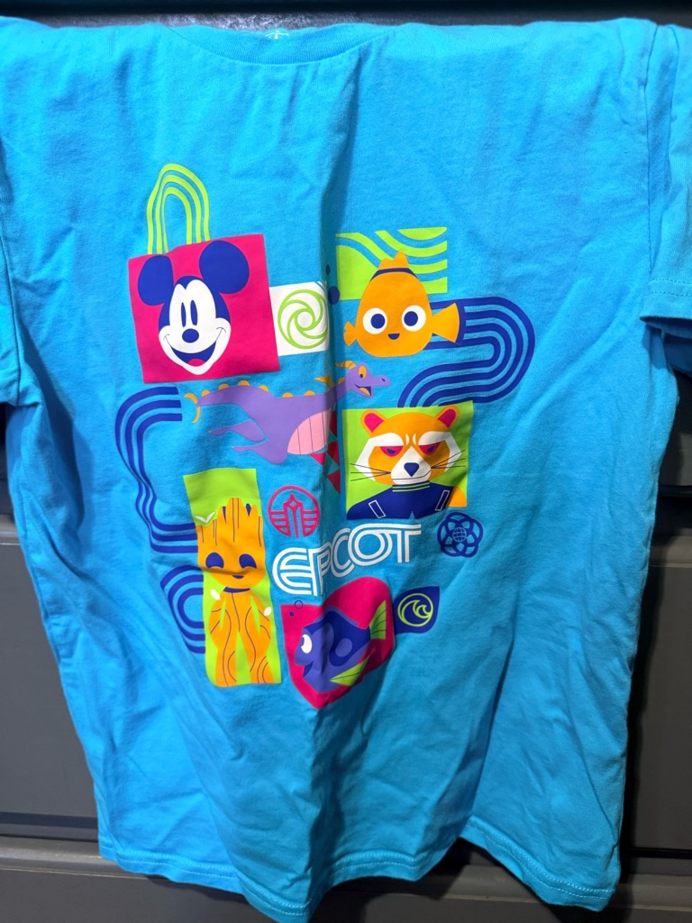 Disney EPCOT Bright Blue Graphic Tee with Multicolor Character Blocks